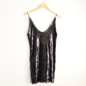 New! Free People black and rose gold top.